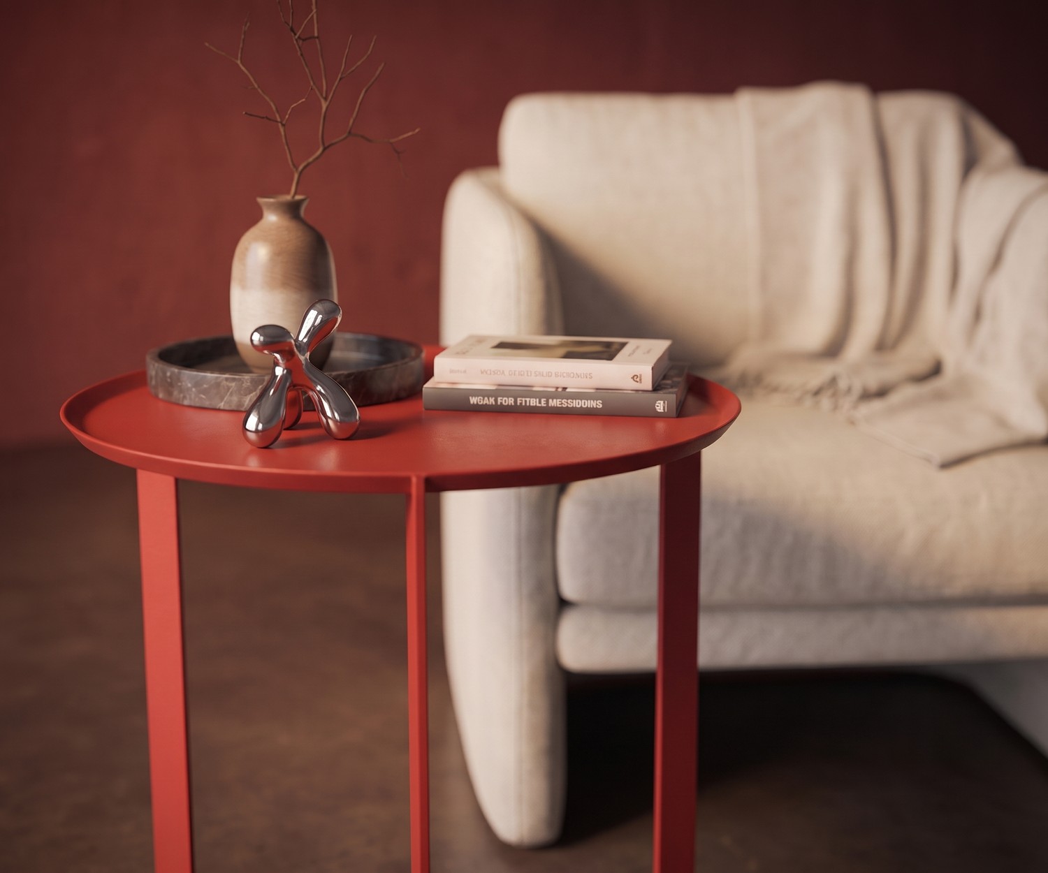 MEME Design Round Beistelltisch aus Metall in Rot als eleganter Ablagetisch neben einem Sessel im Wohnzimmer.