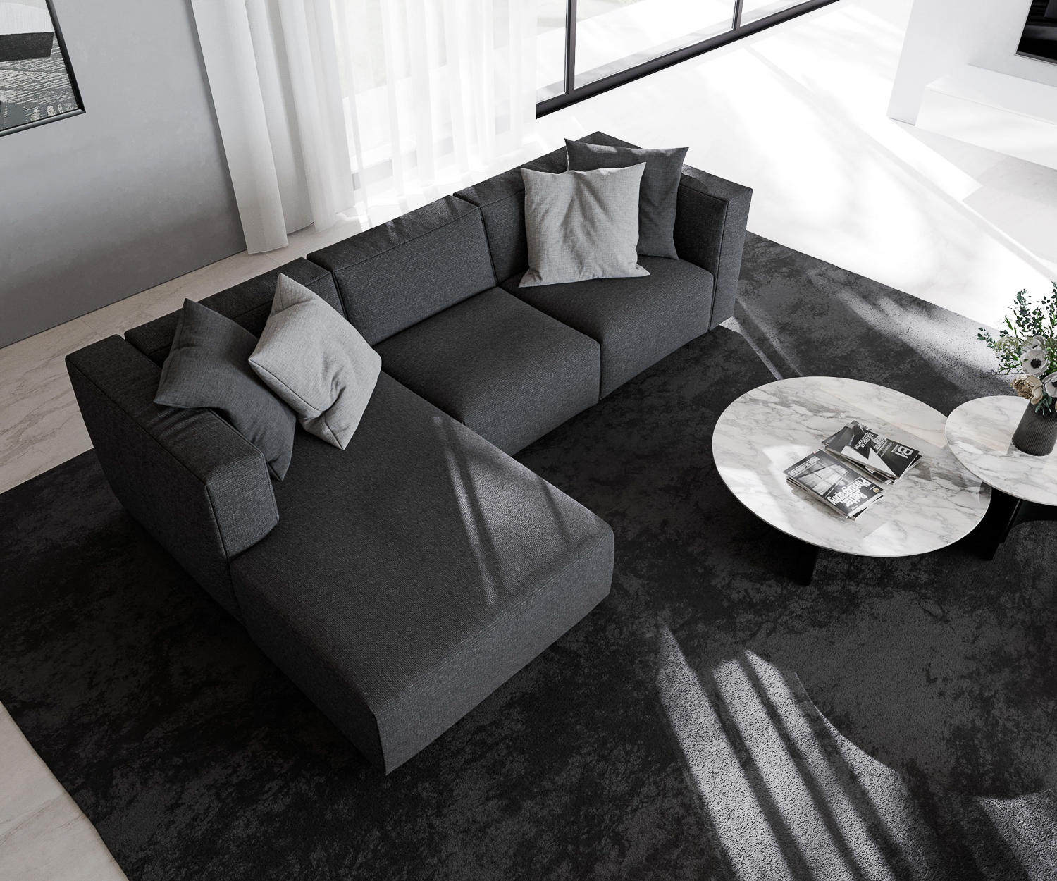 Schwarzes Prostoria Sofa Match L mit Recamiere von oben mit couchtisch in designer wohnung vor balkonfenster 2 sitzer dreisitzer Schwarzes Prostoria Sofa Match L mit Recamiere von oben mit couchtisch in designer wohnung vor balkonfenster 2 sitzer dreisitzer