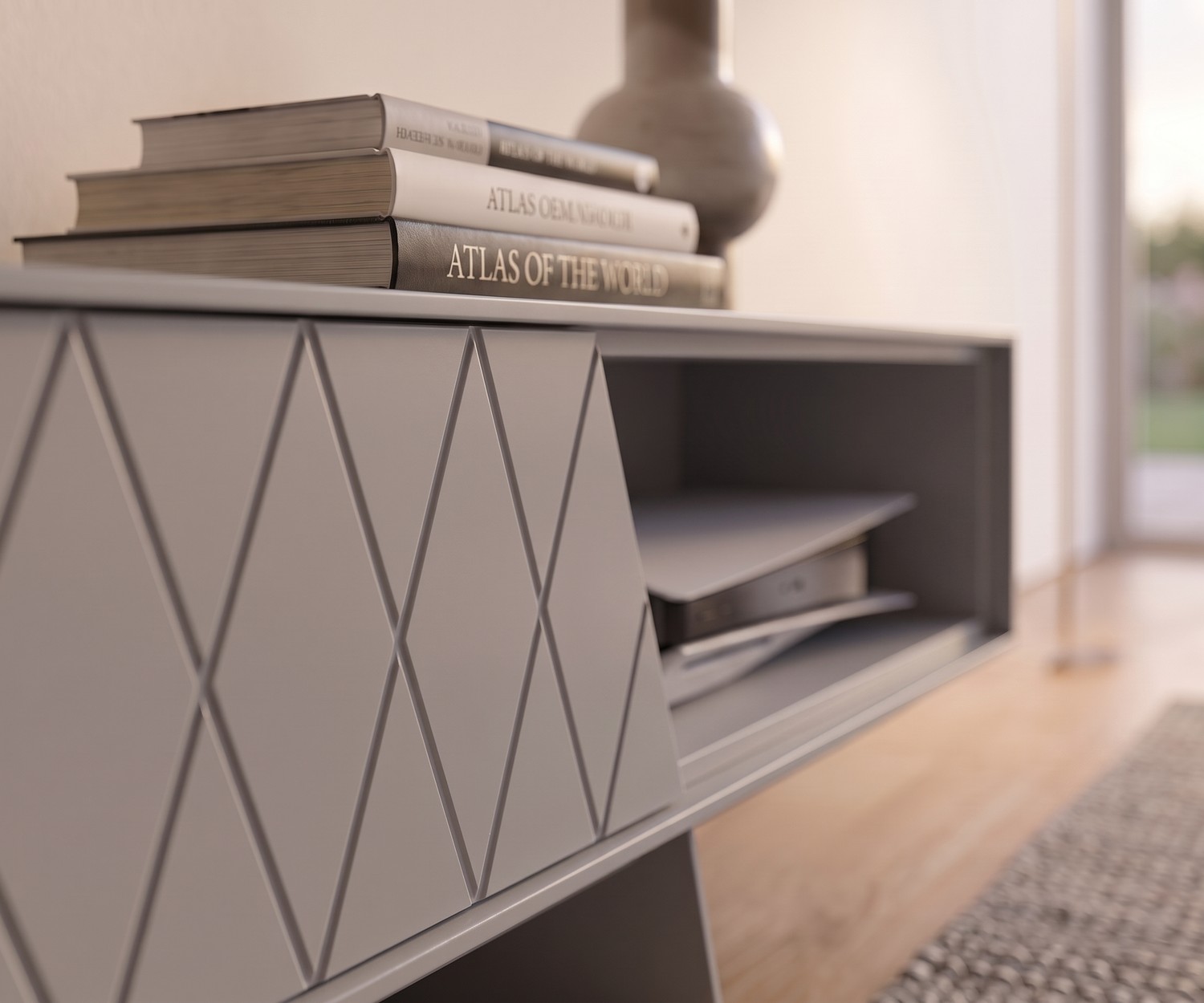 TV Lowboard e-klipse 008 von al2 im Wohnzimmer. Modernes graues Design-TV-Möbel mit Rautenmuster, Büchern und Spielekonsole.