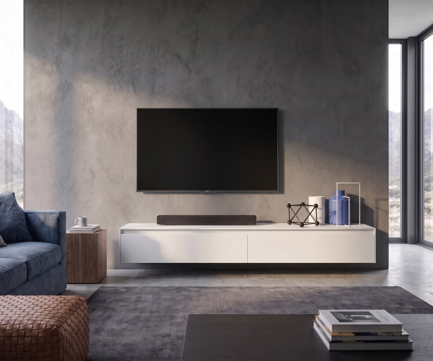 Hängendes TV-Lowboard Novamobili Reverse im modernen Wohnzimmer vor Sichtbetonwand in Weiß.